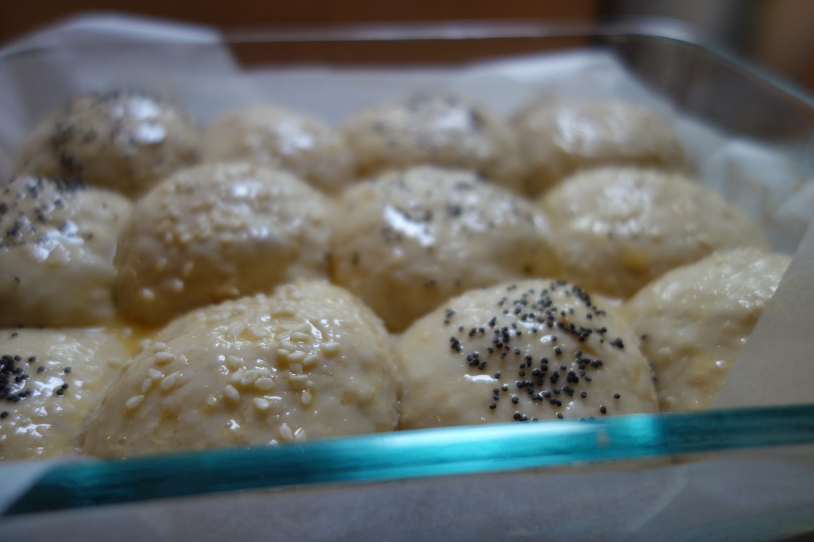 Risen Sourdough Buns sprinkled with Seeds